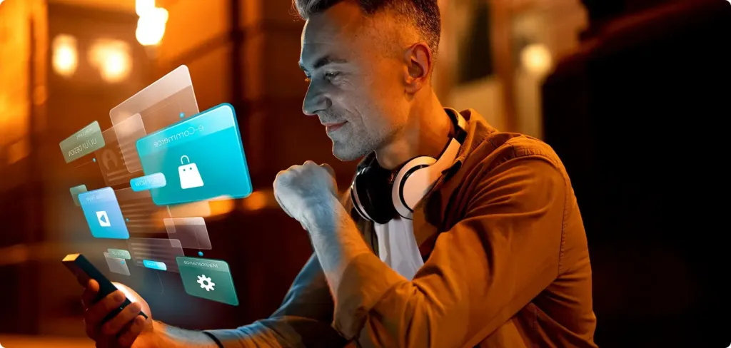 Un jeune homme consulte des applications sur son smartphone